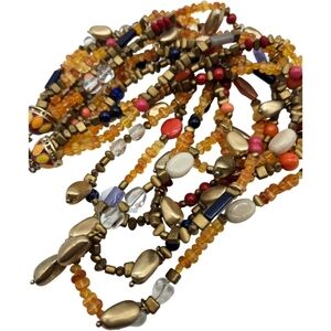 Colorful multi strand beaded necklace with decorative bead closure